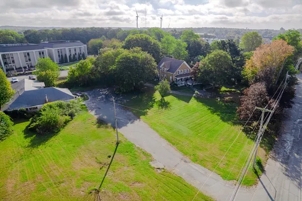 a view of a garden with a building in the background
