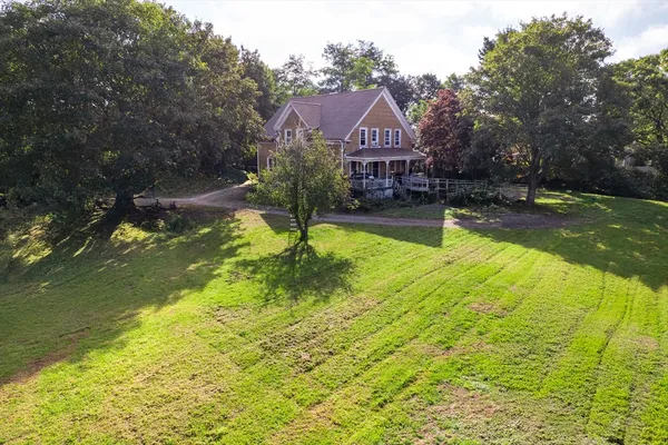 a view of a house with a back yard