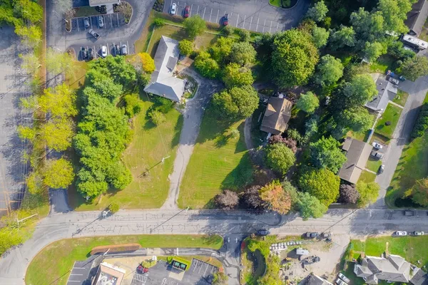 a view of a house with yard and a garden