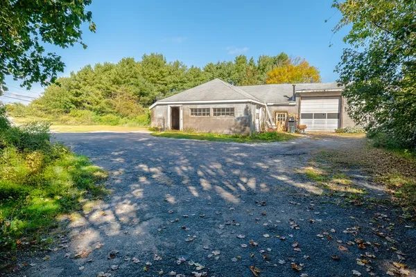 a house with swimming pool in front of it