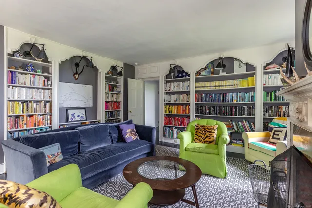 a living room with furniture and a rug