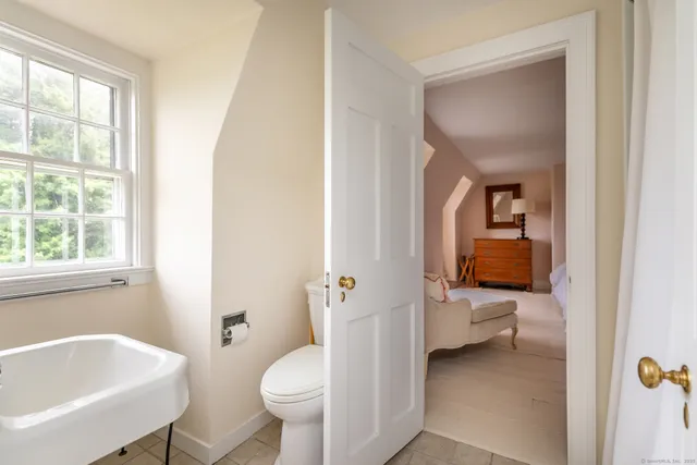 a bathroom with a sink toilet and tub