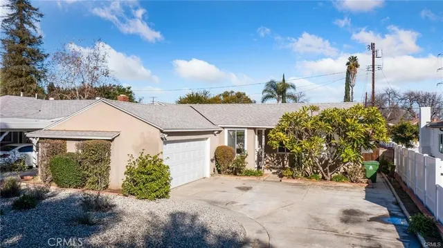 a view of a house with a outdoor space and garden