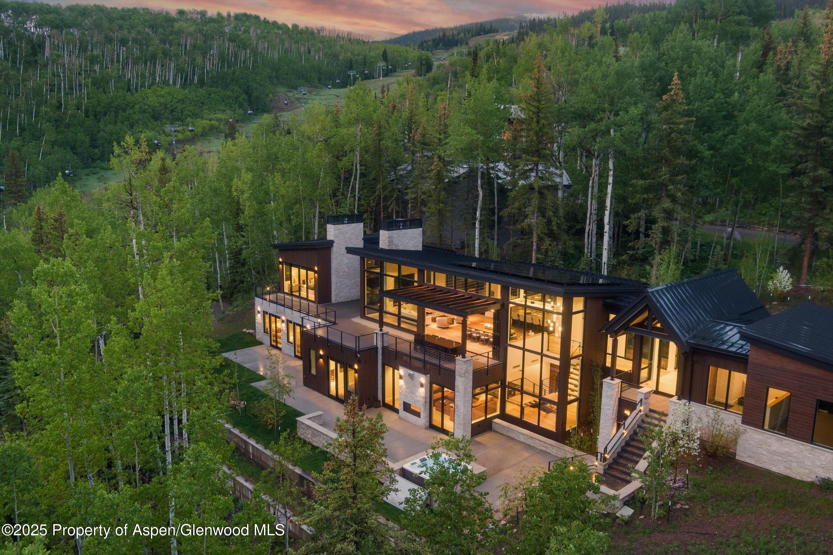 1234 Wood Road Snowmass Village, CO 81615 - Photo 2 of 66 a view of a house with balcony and trees al around