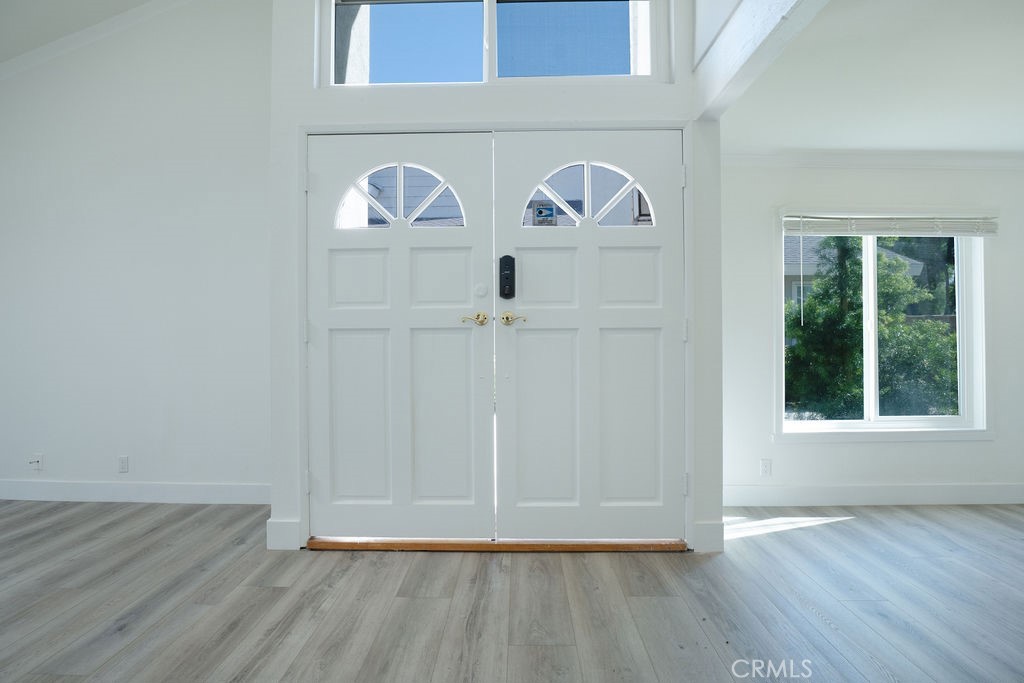 13 Brookmont, Unit 60 Irvine, CA 92604 - Photo 13 of 24 a view of entryway with wooden floor