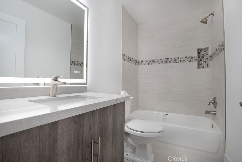 13 Brookmont, Unit 60 Irvine, CA 92604 - Photo 21 of 24 a bathroom with a sink a toilet and shower
