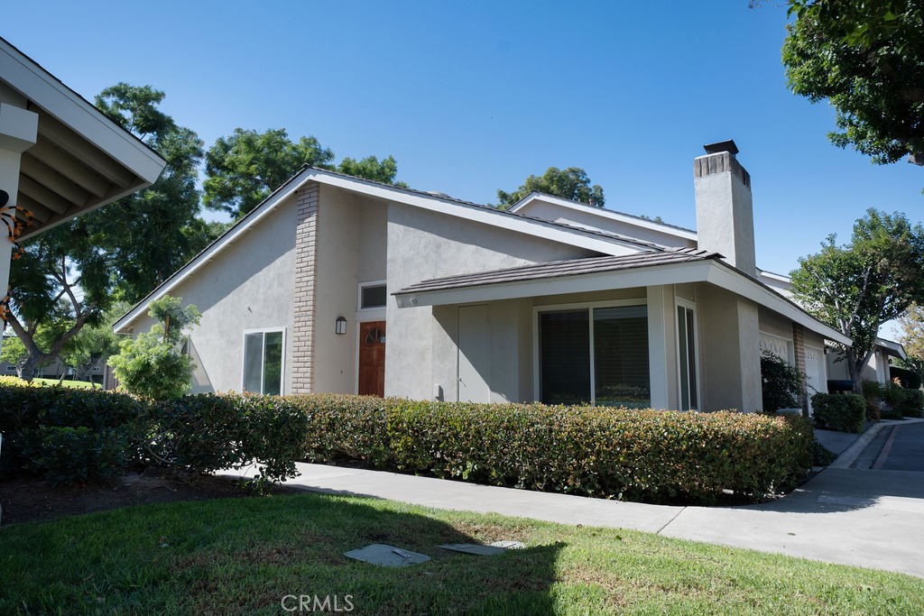 13 Brookmont, Unit 60 Irvine, CA 92604 - Photo 24 of 24 a view of a house with a yard