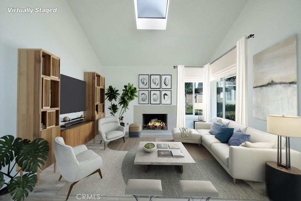 13 Brookmont, Unit 60 Irvine, CA 92604 - Photo 4 of 24 a living room with furniture flat screen tv and a fireplace