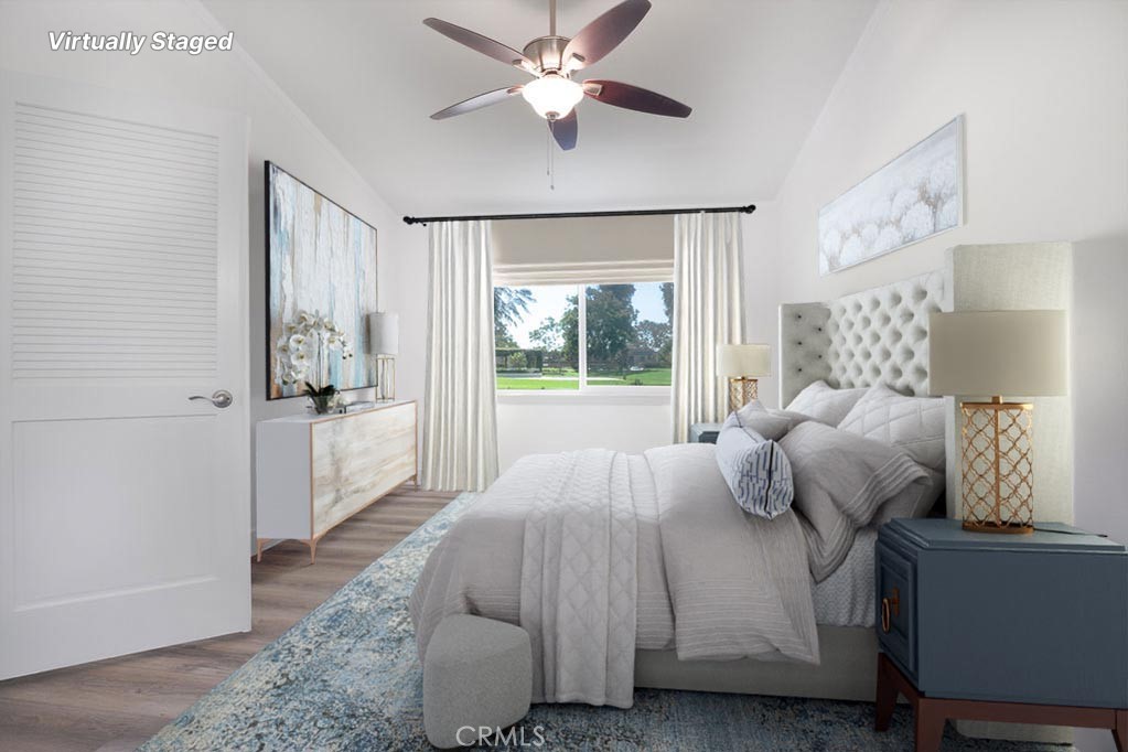 13 Brookmont, Unit 60 Irvine, CA 92604 - Photo 6 of 24 a bedroom with a large bed and a chandelier