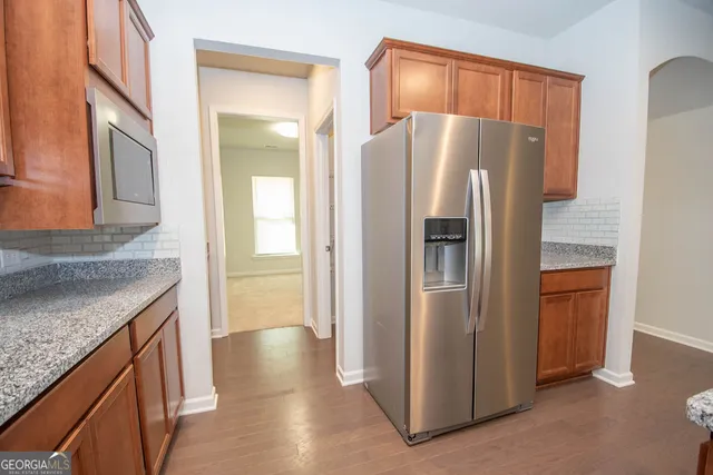 a bathroom with a granite countertop sink and vanity