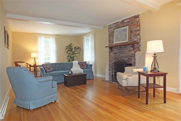 1 Blacksmith Road Chelmsford, MA 01824 - Photo 13 of 29 a living room with furniture and a fireplace