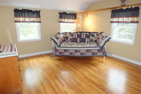 1 Blacksmith Road Chelmsford, MA 01824 - Photo 18 of 29 a living room with couch and wooden floor