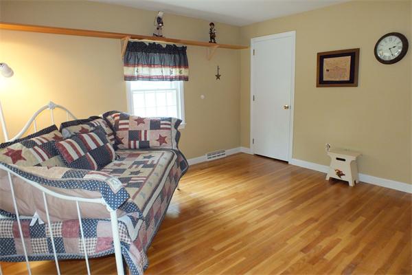 1 Blacksmith Road Chelmsford, MA 01824 - Photo 19 of 29 a bedroom with a bed and wooden floor