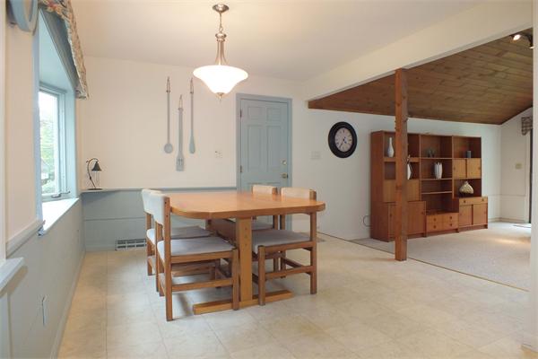 1 Blacksmith Road Chelmsford, MA 01824 - Photo 7 of 29 a view of a dining room and kitchen with furniture and a chandelier