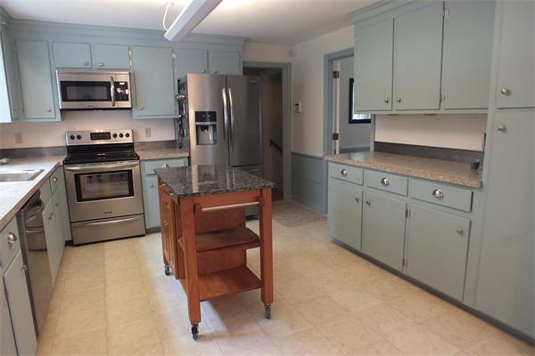 1 Blacksmith Road Chelmsford, MA 01824 - Photo 9 of 29 a kitchen with stainless steel appliances a refrigerator stove and sink