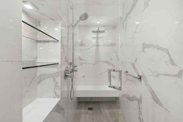 a bathroom with a bathtub and a shower