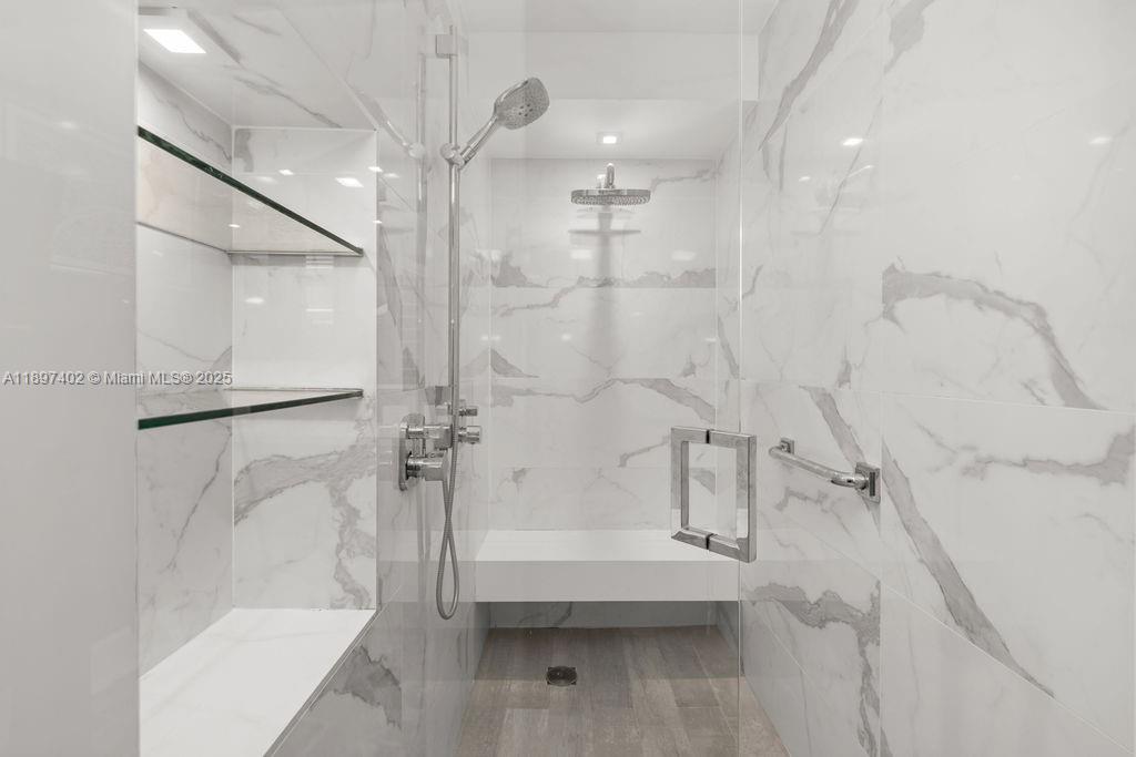 2843 South Bayshore Drive, Unit 4B Miami, FL 33133 - Photo 11 of 25 a bathroom with a bathtub and a shower