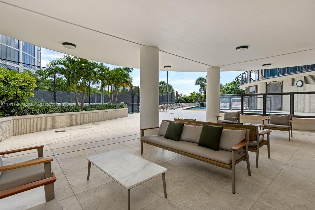 2843 South Bayshore Drive, Unit 4B Miami, FL 33133 - Photo 20 of 25 a outdoor living space with furniture and a potted plant