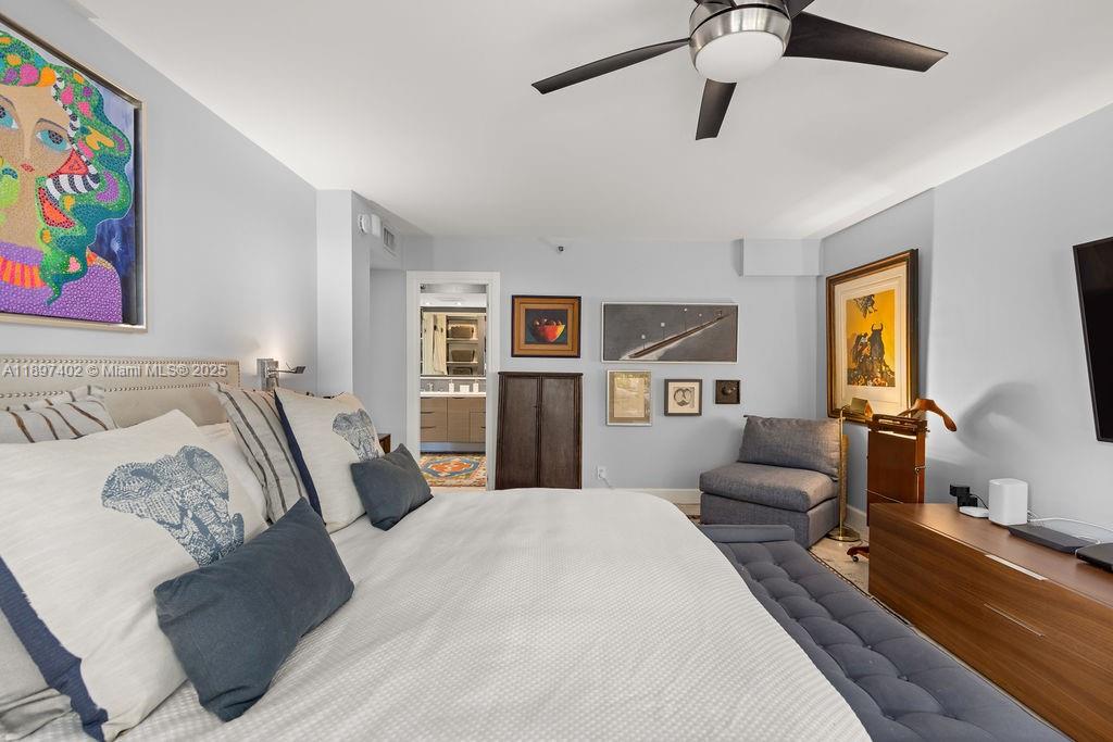 2843 South Bayshore Drive, Unit 4B Miami, FL 33133 - Photo 9 of 25 a bedroom with bed and furniture