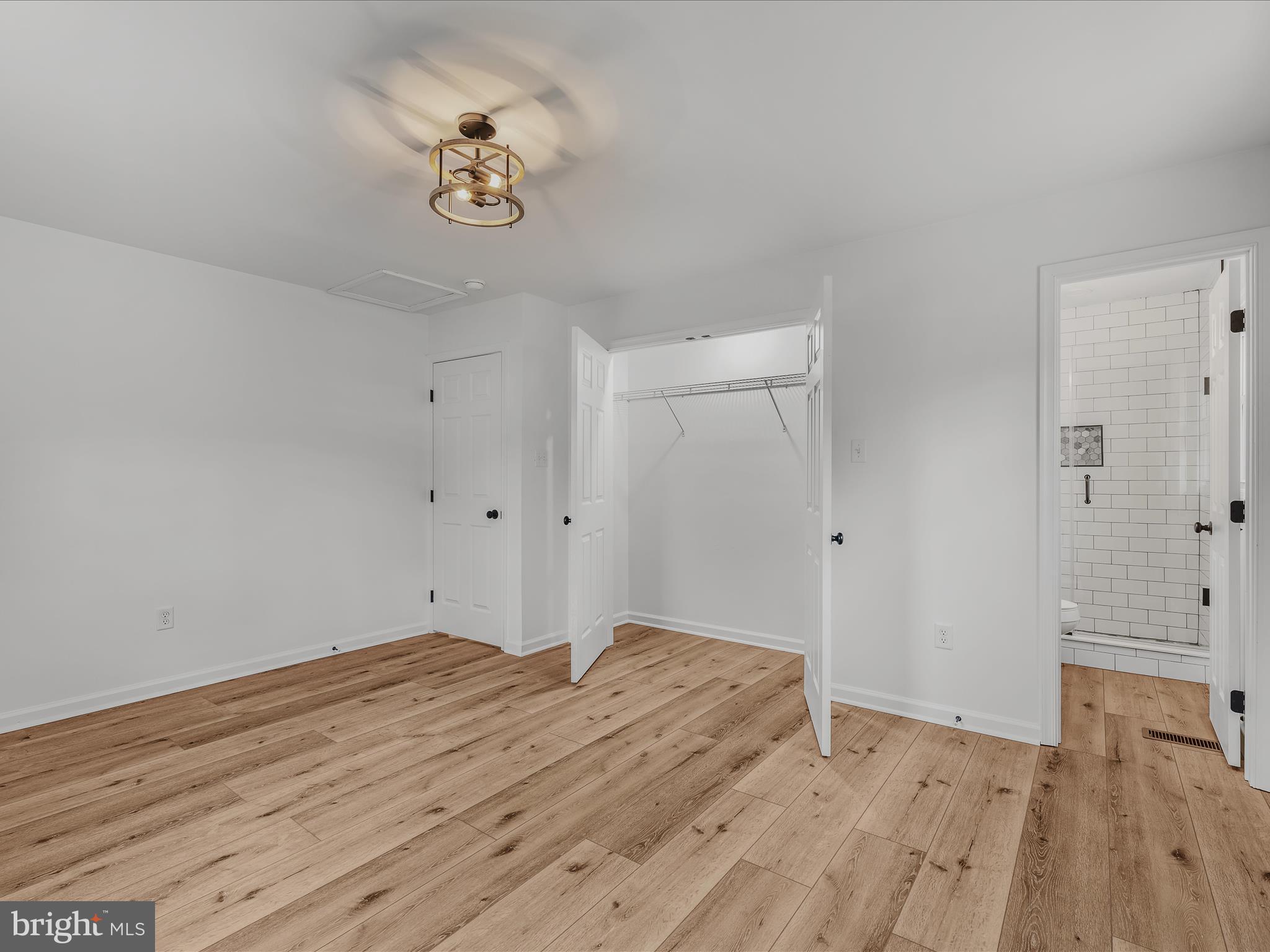 89 Morgan Grove Road Shepherdstown, WV 25443 - Photo 30 of 68 a view of a room with wooden floor and a ceiling fan