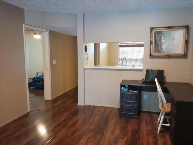 a white toilet sitting next to a shower