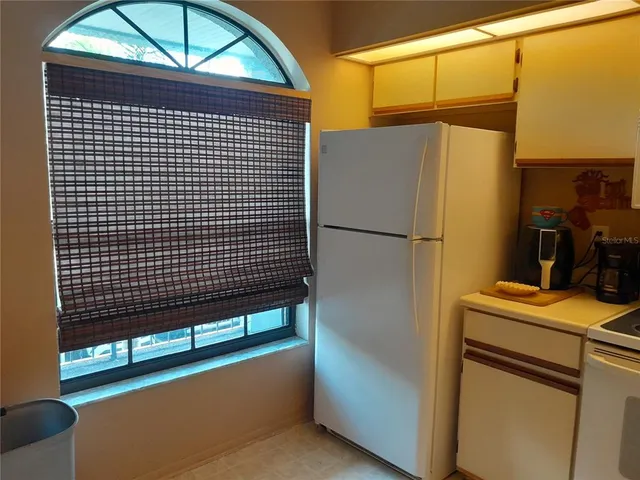 a view of street with parked cars