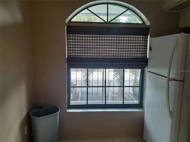 a view of a building with car parked