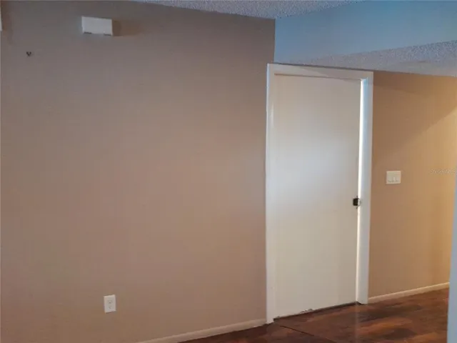 a view of a house with a small yard and plants