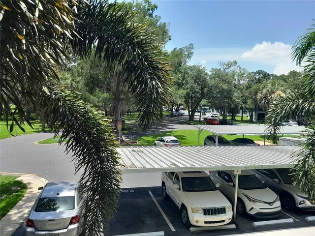 a view of a workspace with furniture and wooden floor