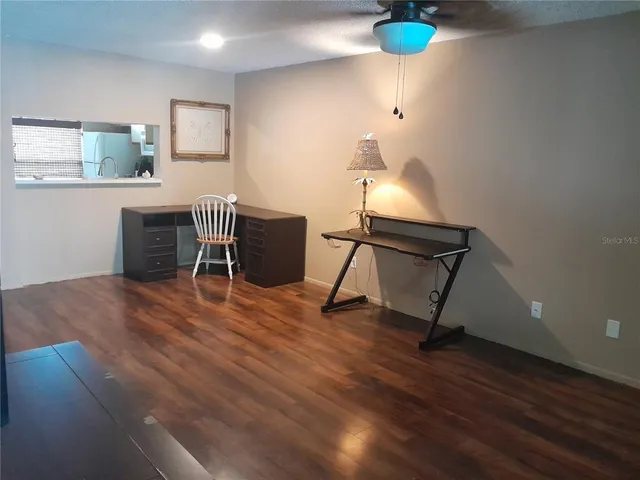 a kitchen with a sink and a mirror