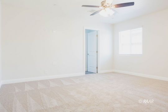 909 West Wasp Avenue Ridgecrest, CA 93555 - Photo 22 of 33 an empty room with a window and a fan