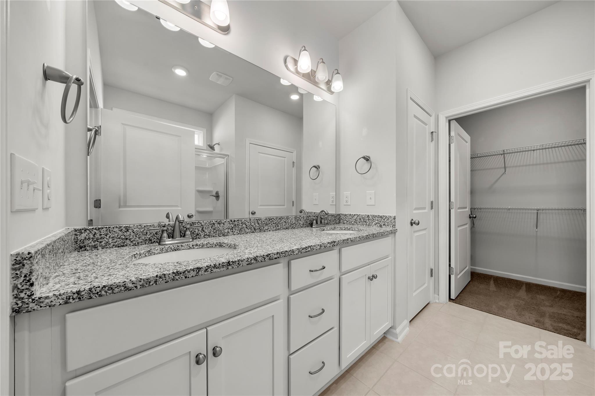 7184 Indigo Way Denver, NC 28037 - Photo 16 of 41 a bathroom with a granite countertop double vanity sink and a mirror
