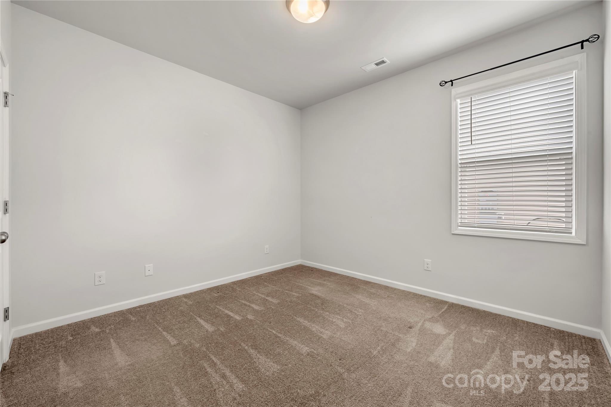 7184 Indigo Way Denver, NC 28037 - Photo 20 of 41 an empty room with a window