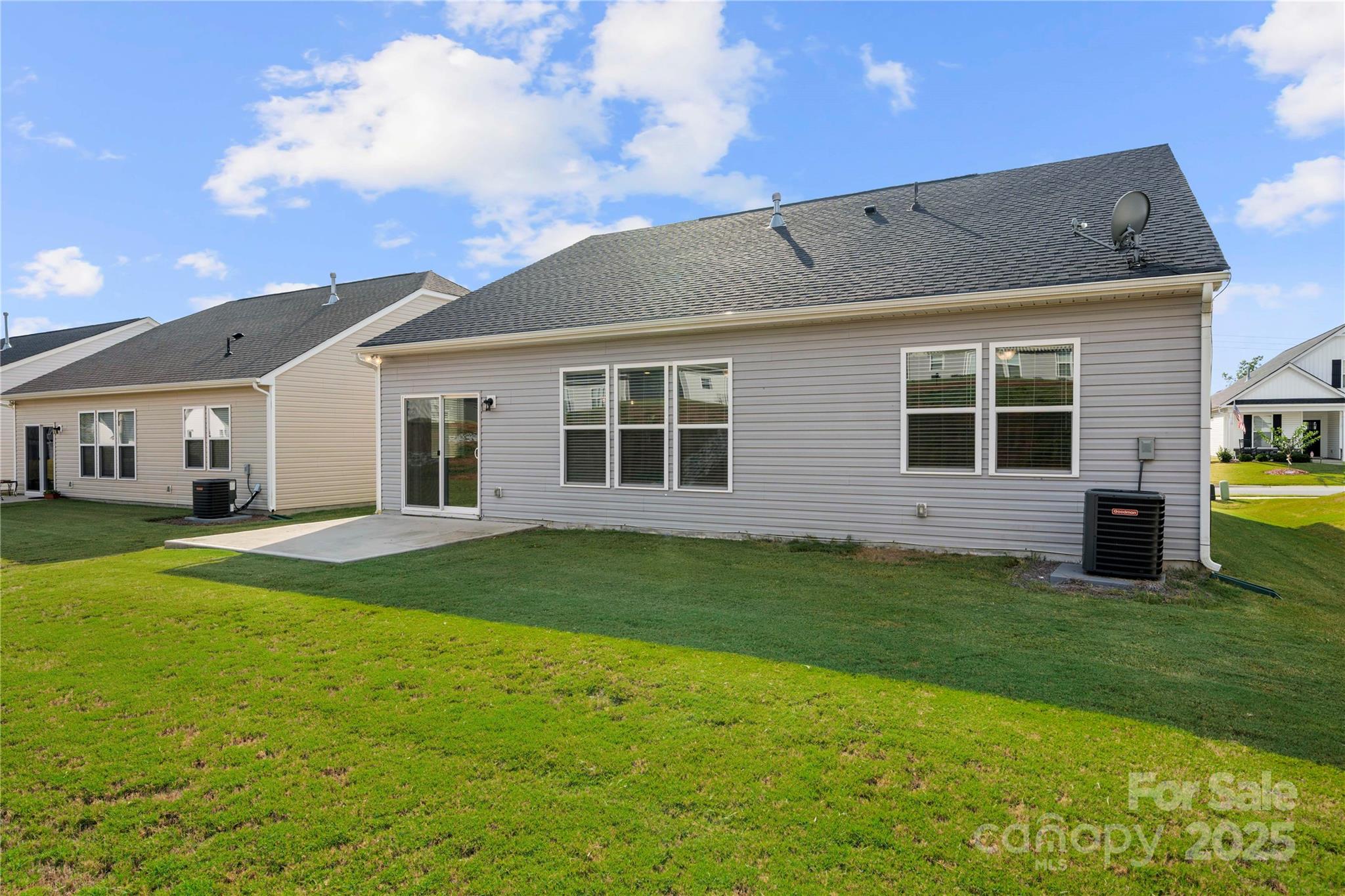 7184 Indigo Way Denver, NC 28037 - Photo 35 of 41 a backyard of a house with table and chairs