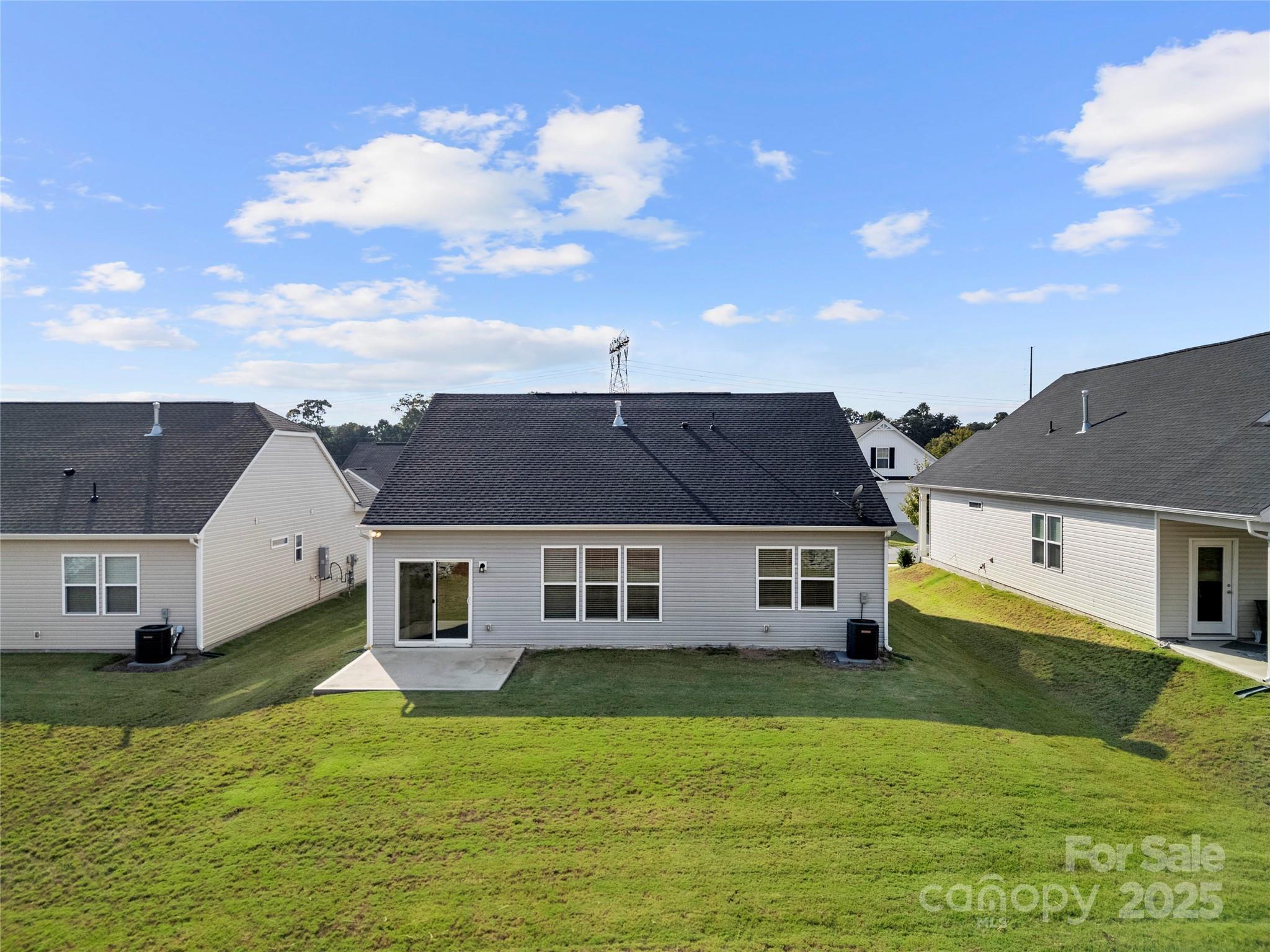 7184 Indigo Way Denver, NC 28037 - Photo 36 of 41 a aerial view of a house with swimming pool and a yard