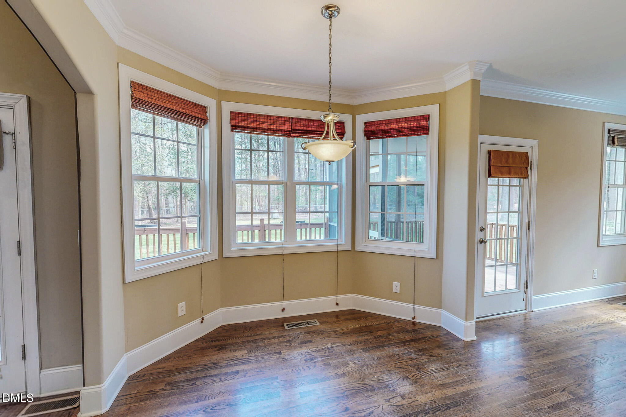 128 Cardens Cove Road Timberlake, NC 27583 - Photo 9 of 54 a view of an empty room with wooden floor and a window