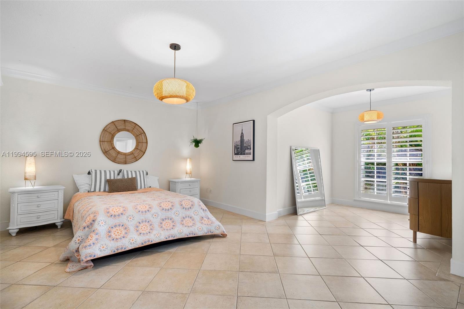 6801 Southwest 126th Terrace Pinecrest, FL 33156 - Photo 15 of 30 a bedroom with a bed and a table