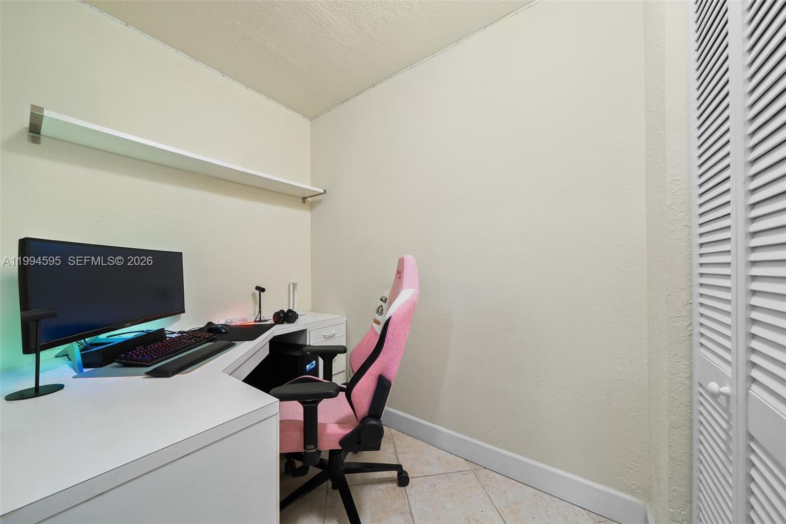 6801 Southwest 126th Terrace Pinecrest, FL 33156 - Photo 20 of 30 a workspace with furniture and a computer
