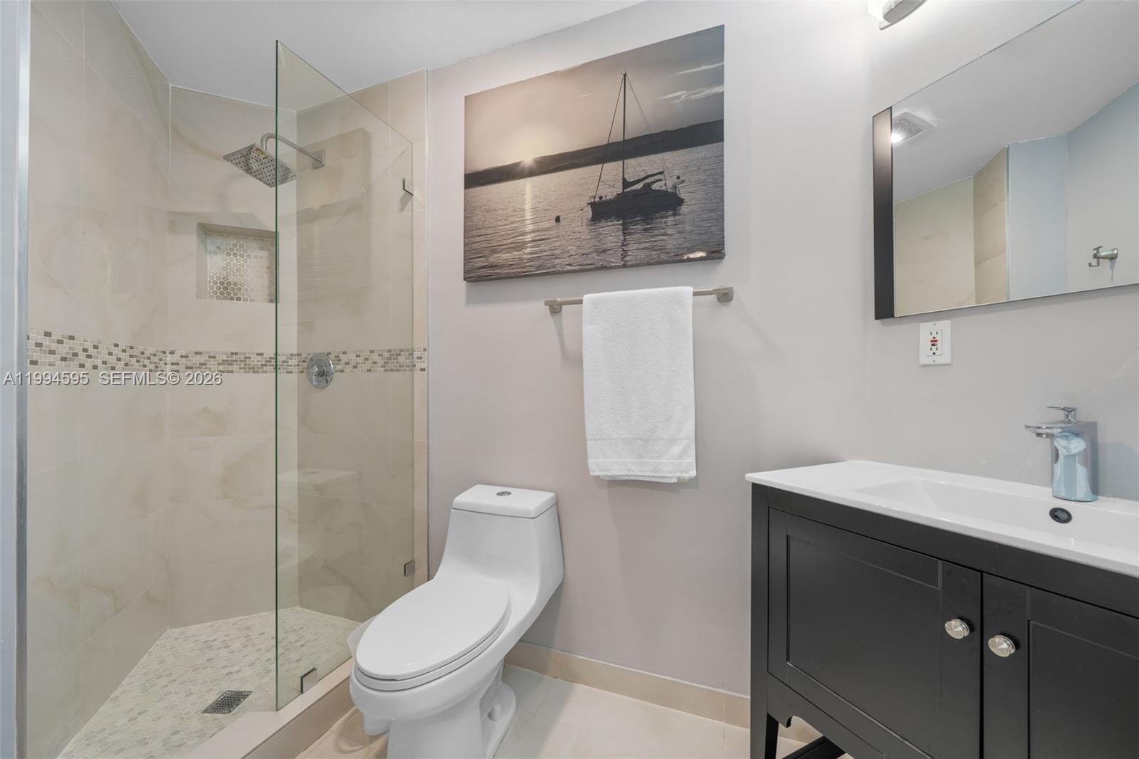 6801 Southwest 126th Terrace Pinecrest, FL 33156 - Photo 22 of 30 a bathroom with a toilet sink and shower