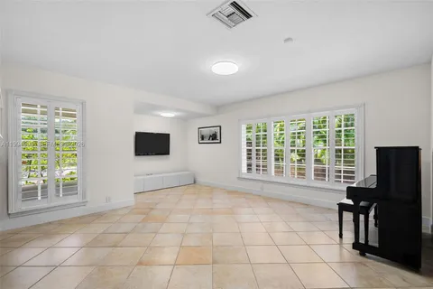 a view of a livingroom with a projector and a window