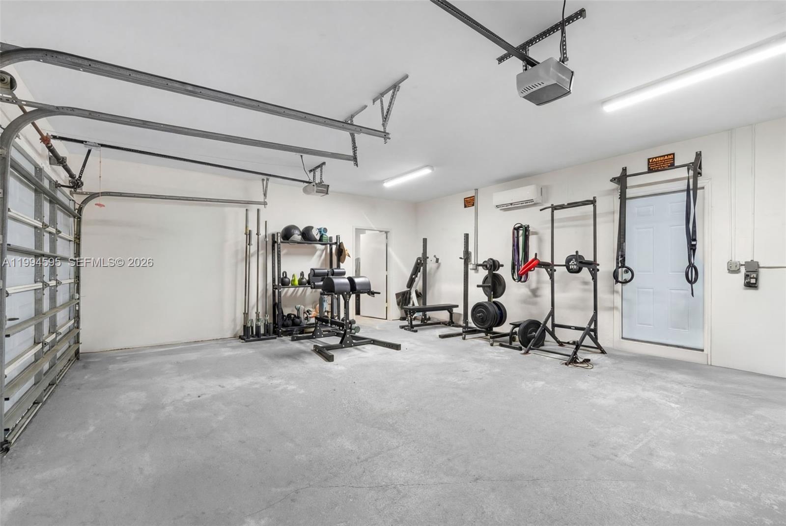 6801 Southwest 126th Terrace Pinecrest, FL 33156 - Photo 25 of 30 a view of a room with gym equipment