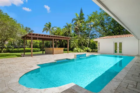 a view of a swimming pool with a patio