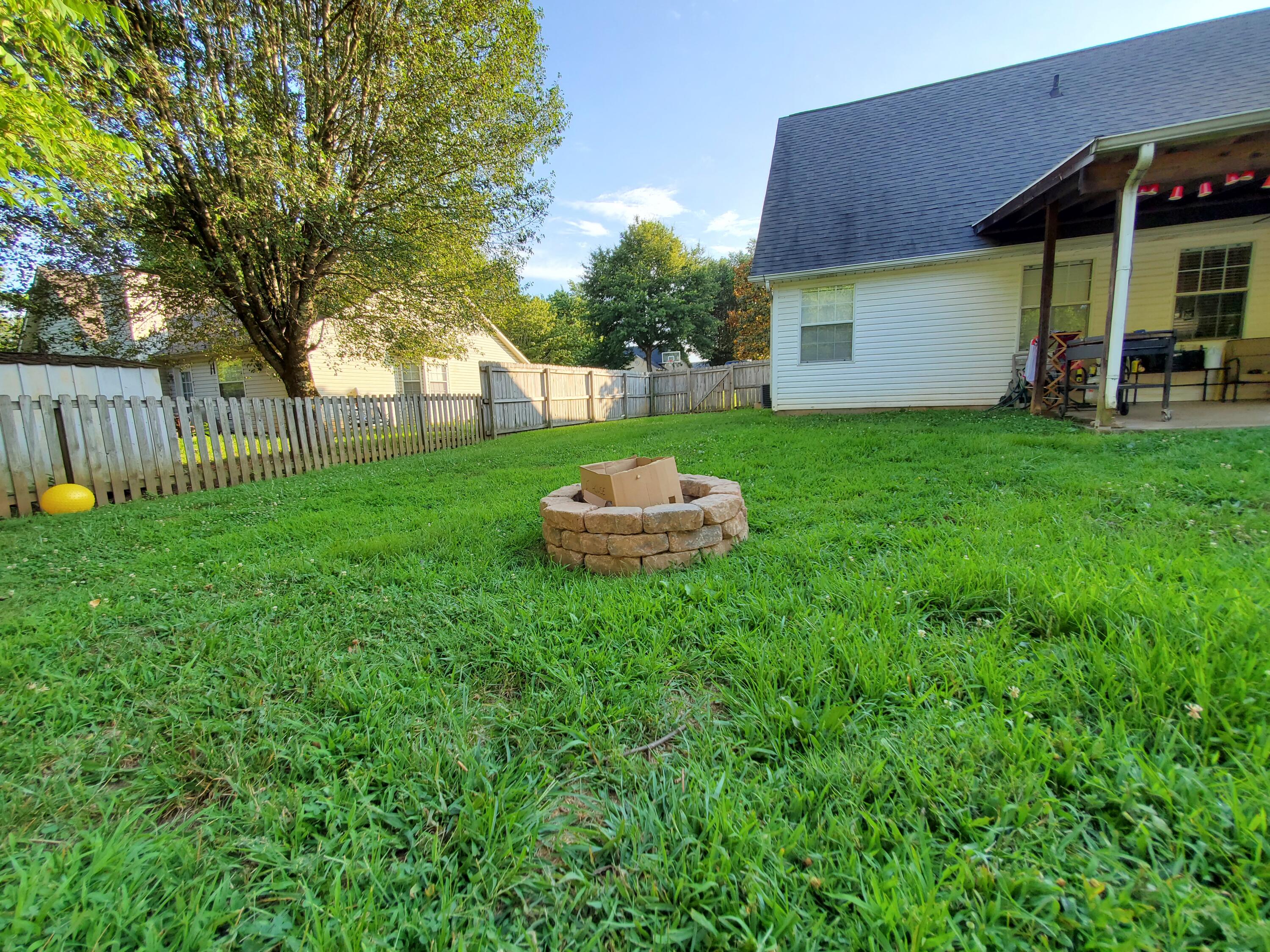 7548 Applecross Road Corryton, TN 37721 - Photo 9 of 26 Firepit in backyard