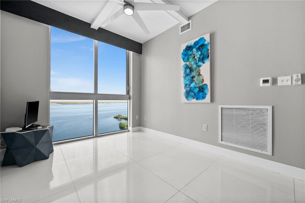 3000 Oasis Grand Boulevard, Unit 2007 Fort Myers, FL 33916 - Photo 21 of 45 a view of a livingroom with a flat screen tv