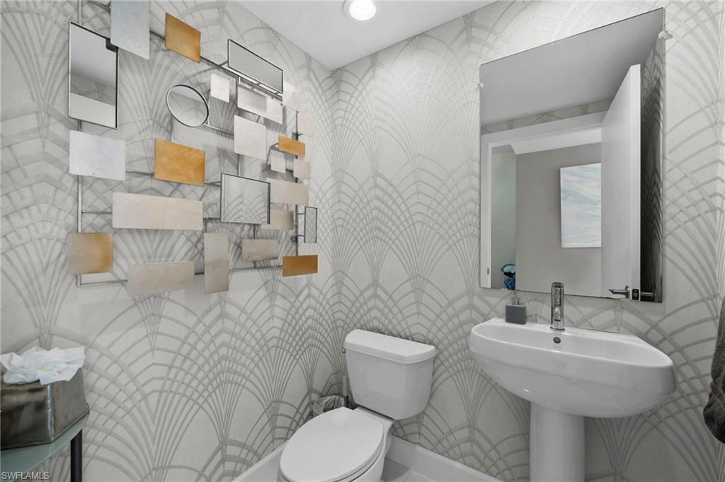 3000 Oasis Grand Boulevard, Unit 2007 Fort Myers, FL 33916 - Photo 23 of 45 a bathroom with a sink toilet and shower