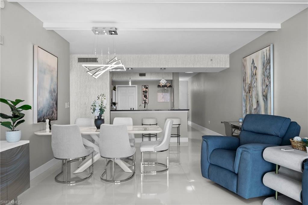 3000 Oasis Grand Boulevard, Unit 2007 Fort Myers, FL 33916 - Photo 34 of 45 a view of a dining room with furniture