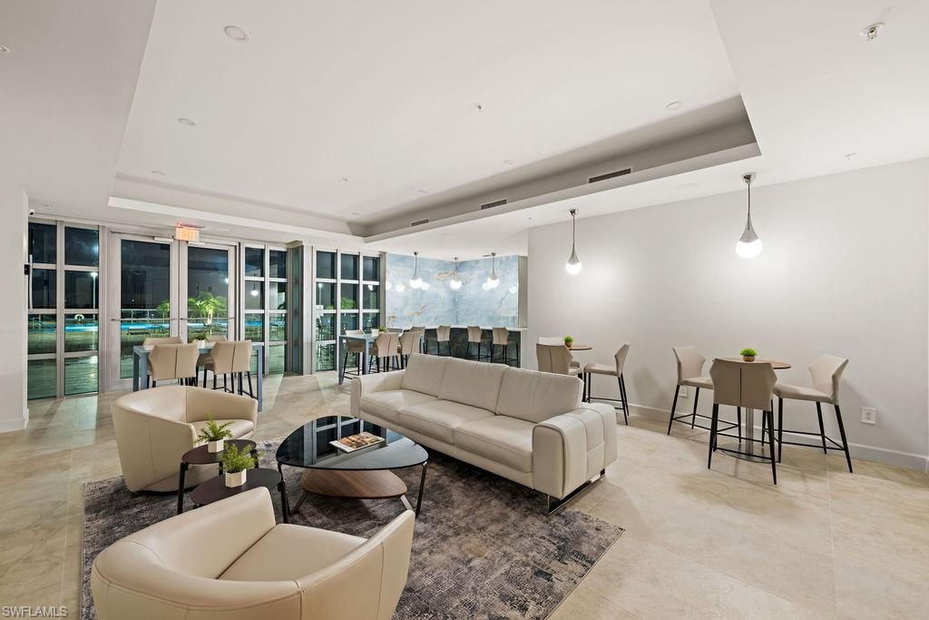 3000 Oasis Grand Boulevard, Unit 2007 Fort Myers, FL 33916 - Photo 42 of 45 a living room with furniture and a large window