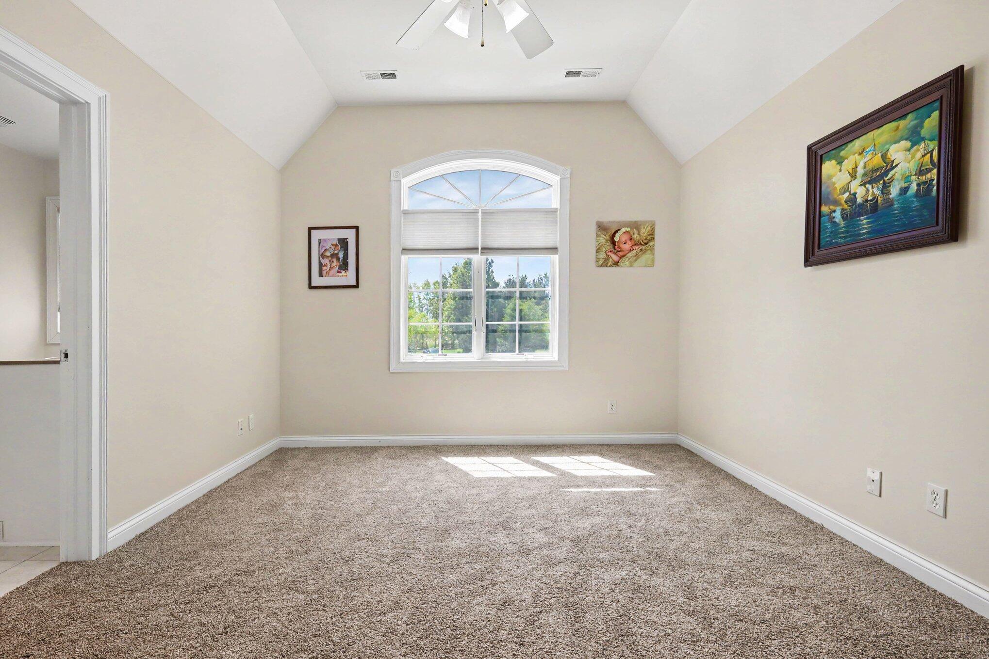 10195 Floyd Street Crown Point, IN 46307 - Photo 12 of 20 an empty room with windows and fan