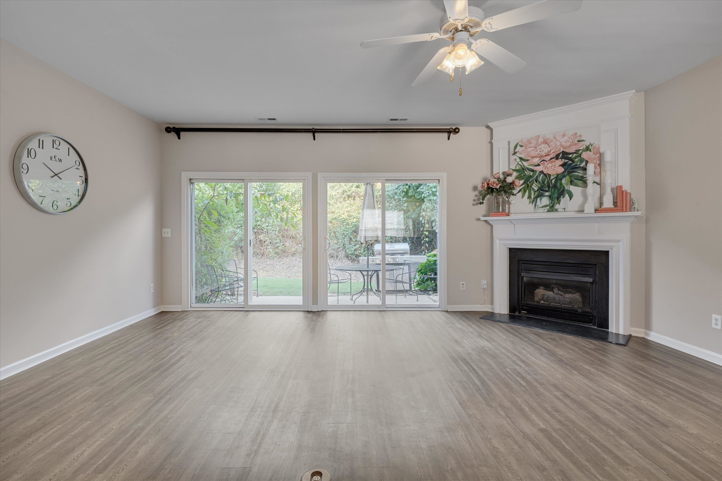 5101 Echo Ridge Road Raleigh, NC 27612 - Photo 7 of 27 Double sliding doors for that indoor/outdoor living vibe and a gas fireplace for those chilly fall nights! Living Room