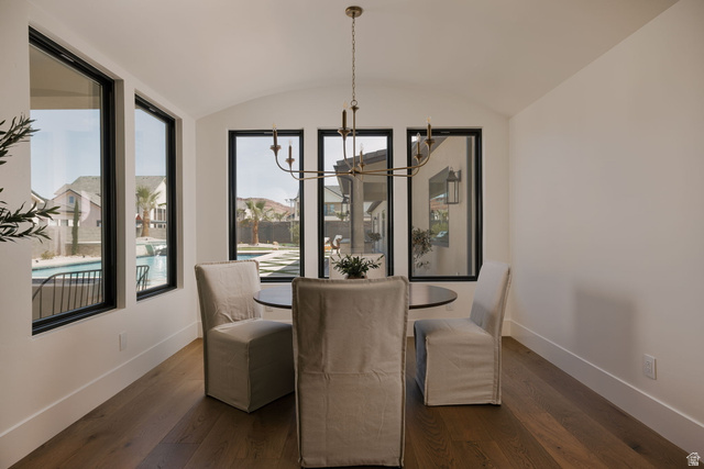 2281 South Crimson Cliffs Way St. George, UT 84790 - Photo 15 of 47 Dining space featuring suspended lighting, wood-type flooring, a barrel ceiling, and healthy amount of natural light